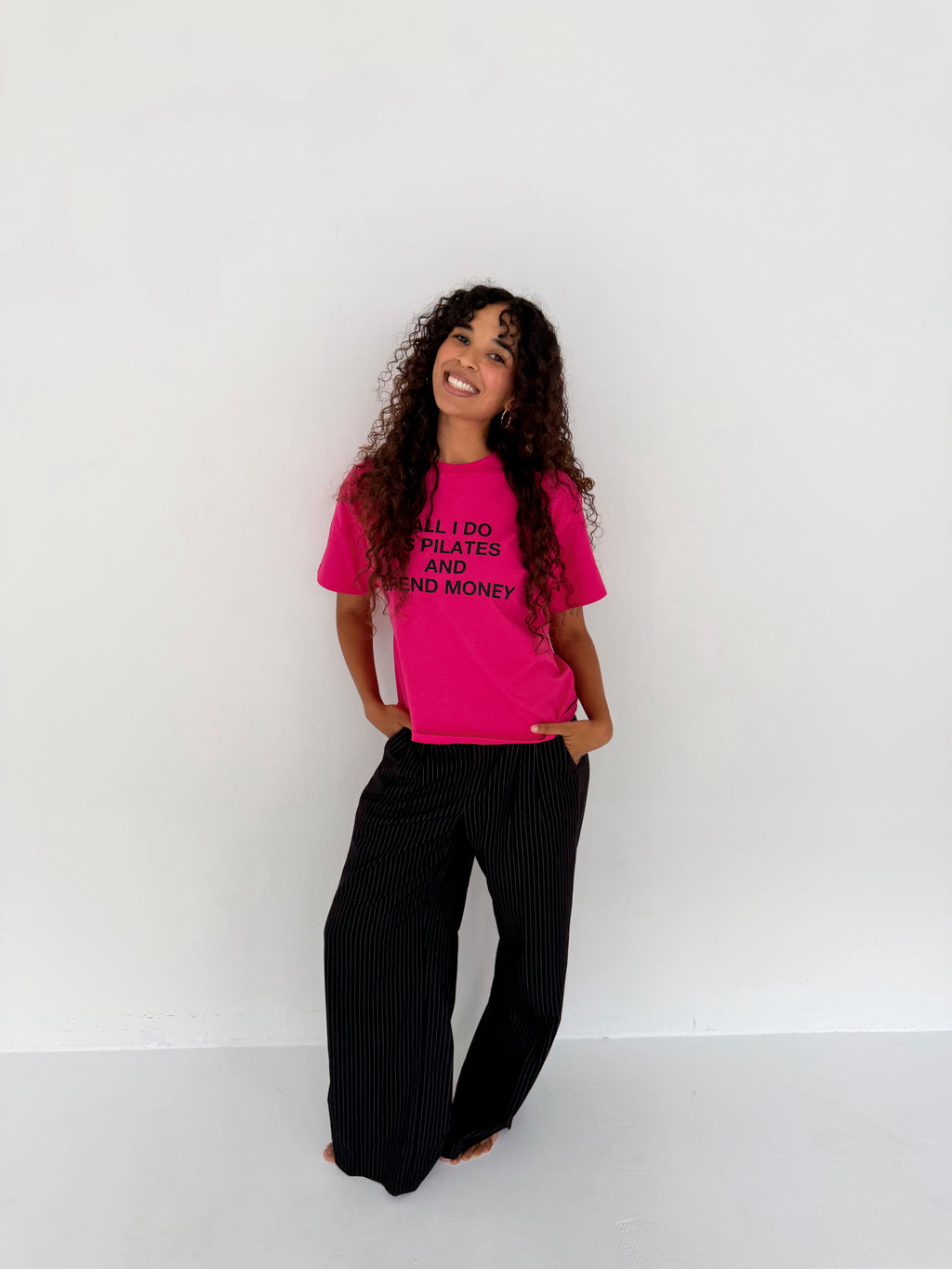 "ALL I DO IS PILATES AND SPEND MONEY" pink tee