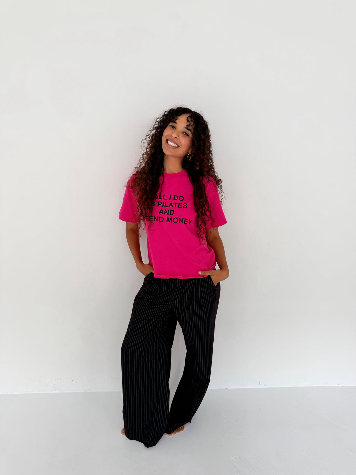 "ALL I DO IS PILATES AND SPEND MONEY" pink tee