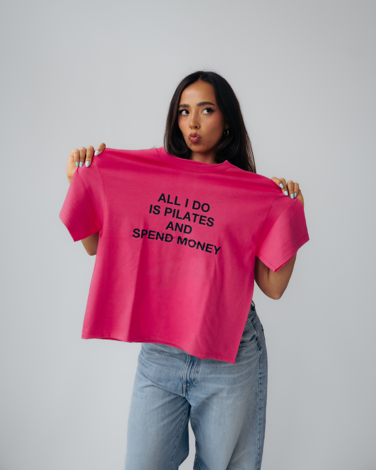 "ALL I DO IS PILATES AND SPEND MONEY" pink tee